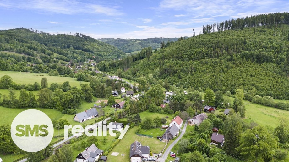 Prodej stavebního pozemku 1 316 m², Holčovice - Spálené